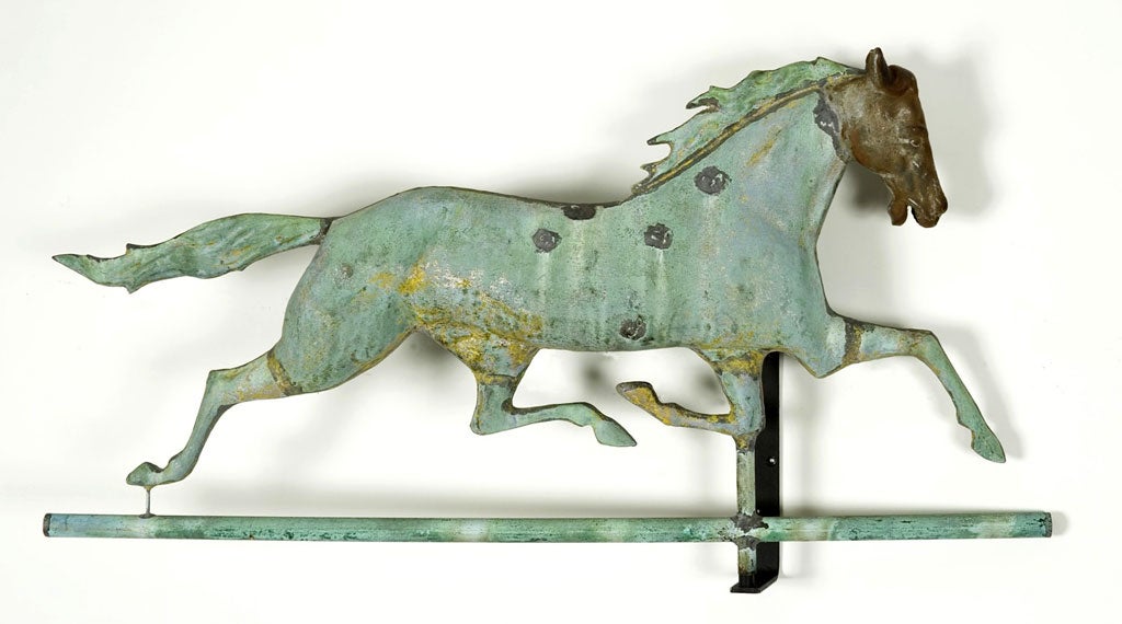 Until sometime last year, this beautiful full-bodied, copper, running horse weathervane could be seen when driving on Route 1A, perched atop a barn on the Boydon farm in Wenham, Massachusetts.  Made circa 1860-1890, the body, mane, tail, and cross