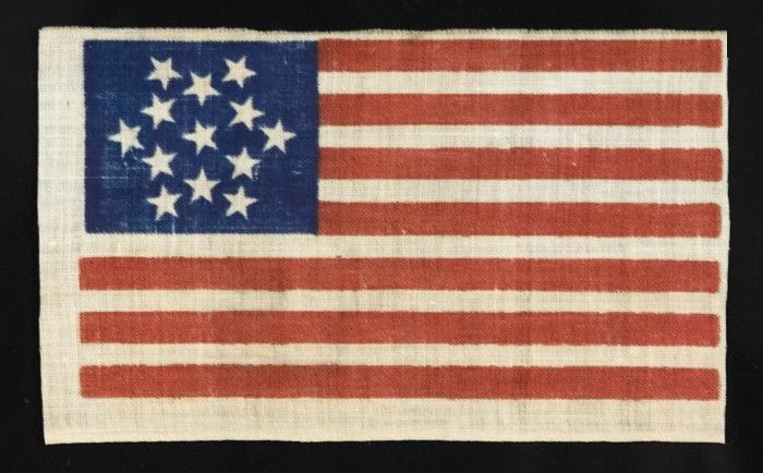 Rare 13 star American parade flag with a 6-pointed great star configuration. The reason behind this design is not known. It may have been made to represent the Star of David, may have a historical connection to a colonial flag, or may simply be a