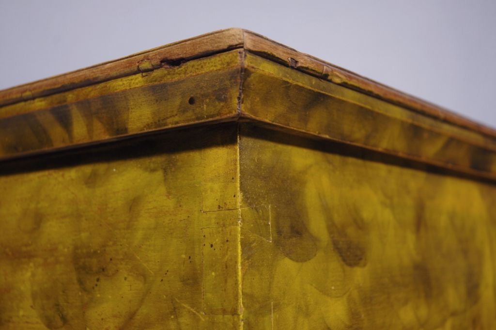 Pennsylvania German (Amish or Mennonite) paint-decorated blanket chest of Lancaster County, Pennsylvania origin. Extensive smoke decoration on a chrome yellow background with green painted trim and green turned feet, circa 1830-1840.