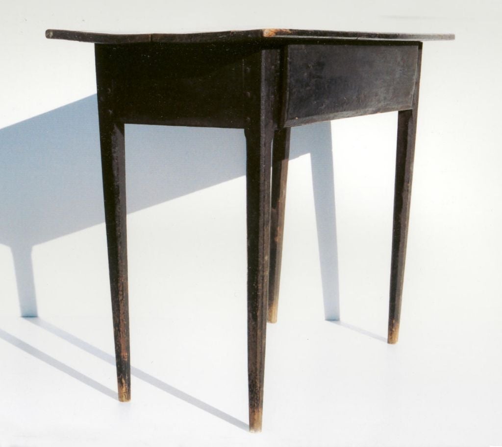 SHENANDOAH VALLEY HUNT-BOARD-TYPE WORK TABLE IN BLACK PAINT, CA 1830-1860:<br />
<br />
Shenandoah Valley yellow pine server, reminiscent of a hunt board in form with its tall height and country Hepplewhite legs. There is a single drawer and a