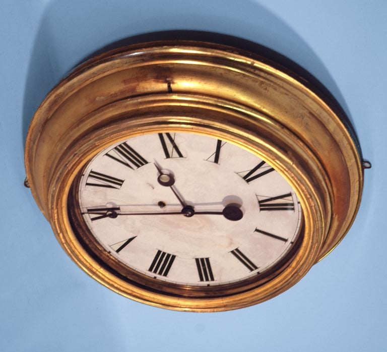 GILDED GALLERY CLOCK, LATE 19TH CENTURY:<br />
20 inch Regulator or gallery clock.  Pine or chestnut case with original gided molding.  Made by Brewsters & Ingrahm, though unmarked.  Bears a repair tag stating that it was cleaned by Robert F. King,