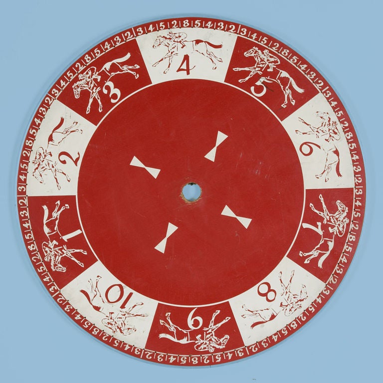 RED AND WHITE GAME WHEEL WITH RUNNING HORES AROUND THE PERIMETER