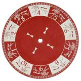 RED AND WHITE GAME WHEEL WITH RUNNING HORES AROUND THE PERIMETER