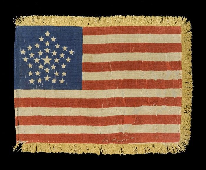 35 STARS, 1863-65, CIVIL WAR PERIOD, RARE GREAT STAR PATTERN & GOLD SILK FRINGE, WEST VIRGINIA STATEHOOD:<br />
<br />
35 star American National parade flag of the Civil War period, printed on silk, with an extremely rare and desirable version of