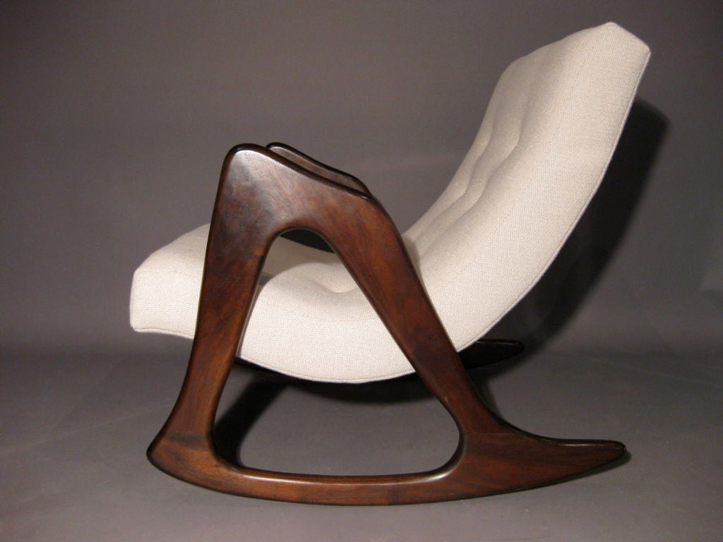 A very sculptural rocking chair designed by Adrian Pearsall for Craft Associates c.1960's. In the style of Vladimir Kagan. Refinished dark walnut frame with new Knoll upholstery.