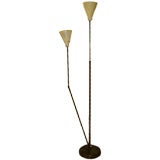 An Adjustable Two Armed Floor Lamp in Brass by Arredoluce