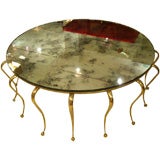 A Round Brass and Mirror Cocktail Table