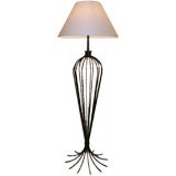 A Wrought Iron Floor Lamp In the Style of Jean Royere