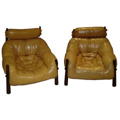 A Pair of Leather and Rosewood Club Chairs by Sergio Rodrigues