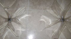 A Large Plexi Glass Based Cocktail Table