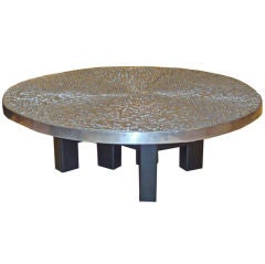 A Round Cast Steel Topped Cocktail Table by Ado Chale