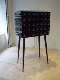 A Standing One Door Cabinet in Mirror and Glass by Roberto Rida