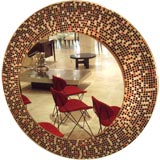 A Large Lit Wall Mirror with a Mosaic Tile Frame
