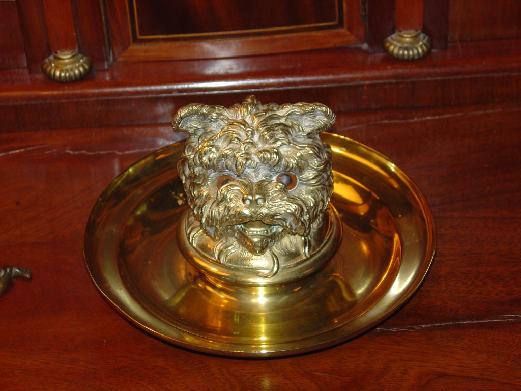 Brass inkwell in the form of a dog's head.