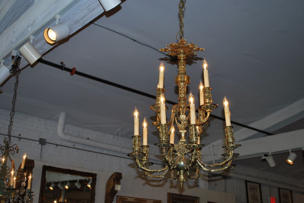 French brass double tier 12-arm chandelier with inserts.<br />
 ( chandelier has been rewired to US standards)