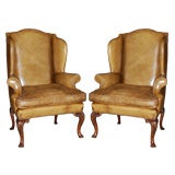 Pair of English leather wing chairs