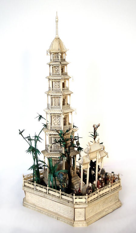 A pair of Chinese ivory model pagodas made in Canton, complete with their garden terraces,trees,tables with precious objects, <br />
scholar's rocks, bells and Buddhas.<br />
<br />
There is a Cantonese ivory boat of the same quality in the