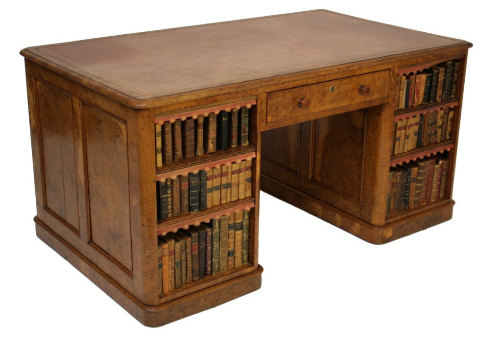 A Victorian pollard oak pedestal partners desk, the three-drawer frieze over pedestals fitted with drawers to one side, open bookcases to the reverse.