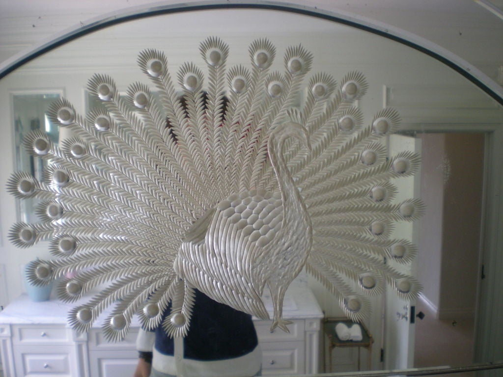 Beautifully etched, Venetian mirror with peacock design. Mirror is mounted on a wooden frame.