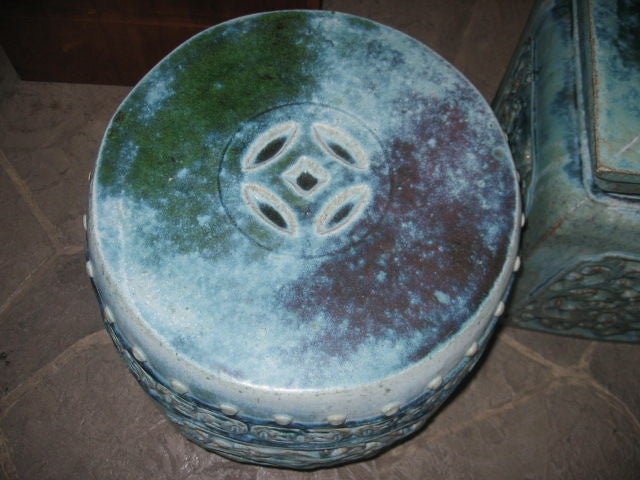 An Assortment of Chinese Provincial Garden Stools. Sizes vary. Celedon colors in glazes of blues and greens. Fretwork and Keyhole designs. Some are available in pairs.