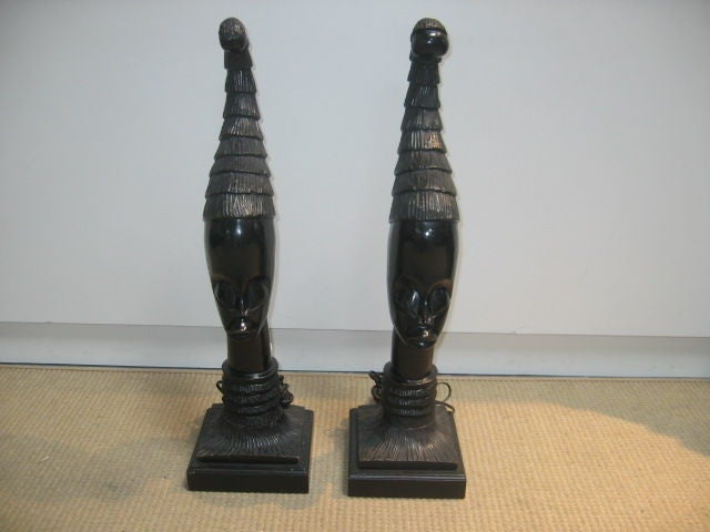 Hand Carved Nubian Lamps. Wooden lamps with newer wiring. High gloss, dark brown-black stain finish.
