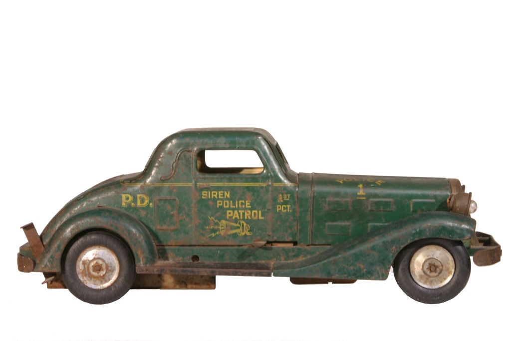 Toy friction operated police car made by Louis Marx and Company in New York City in the 1930's or '40's.