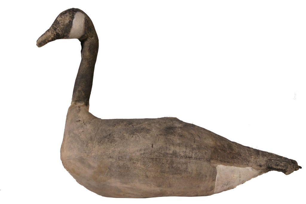 Canvas, a lighter weight material than the more commonly used wood, is from time to time used to fashion large decoys.  This example is finely crafted, essence of goose and highly decorative.