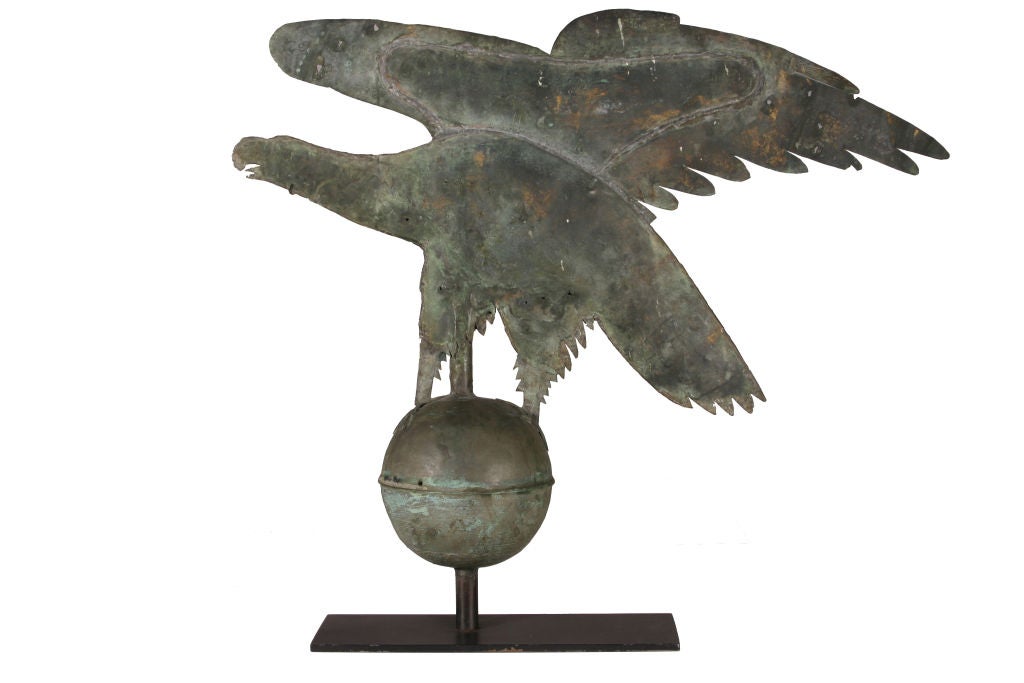 A singular effort and most unusual form for an eagle weathervane.  Probably patterned by a skilled metalworker after the famous Jewell eagle.  Full bodied but thin with a large ball.