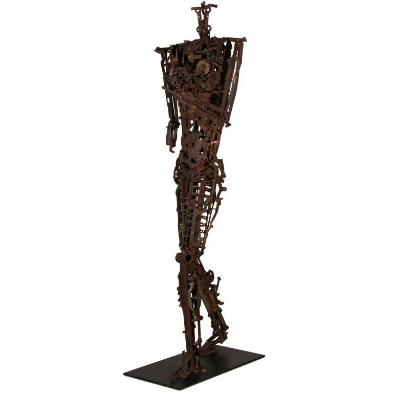 Human form sculpture constructed entirely from early typewriter parts.  Was found in a Lake Zion, Illinois home.  The artist has deftly captured human movement in the assemblage of these elements.