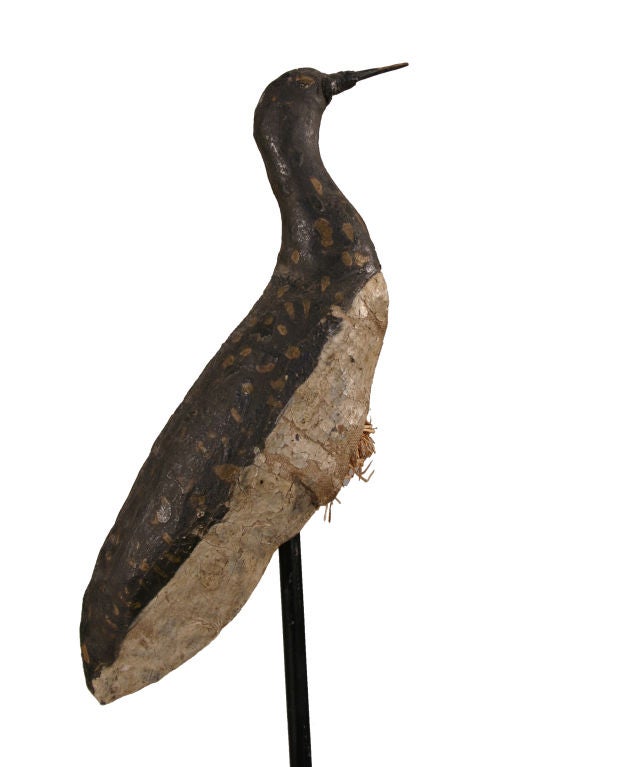 Working shorebird decoy, unusual in that rather than carved from wood, it is fashioned from canvas and straw.