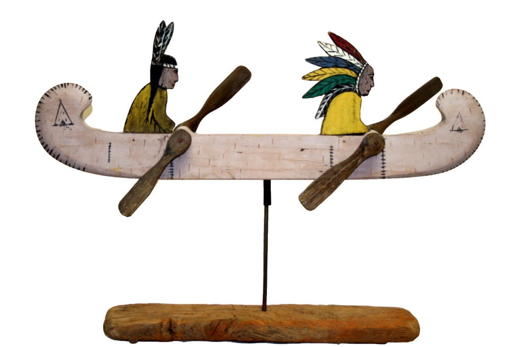 Painted to simulate birch bark (of which early canoes were made), this gorgeous whirligig depicts an Indian chief and squaw in a canoe with double paddles. In forty two years of collecting, this is the first whirligig like this I have ever seen. It