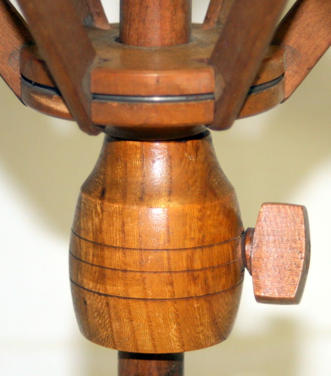 This is a yarn swift from the Mt. Lebanon Shaker Village in New Lebanon, NY. It dates from the 1880s - 1920s. It is made of maple and ash, and still has its original finish. It features adjustable arms with a table clamp and a cup for a pin cushion