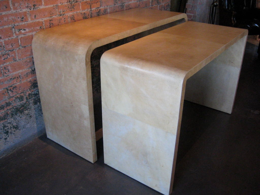American Parchment covered nesting console tables