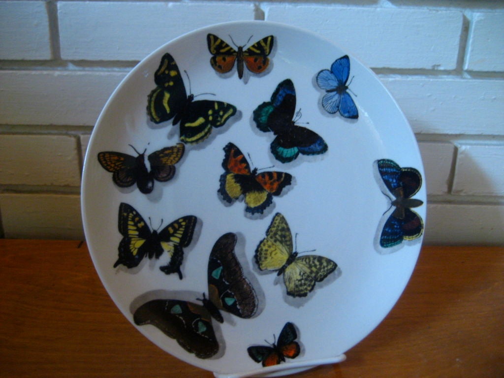 A set of three Butterfly plates designed by Piero Fornasetti dated 1955.