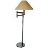 Chrome and brass swing arm floor lamp by Karl Springer