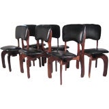six sculpted rosewood/leather dining chairs by Don Shoemaker