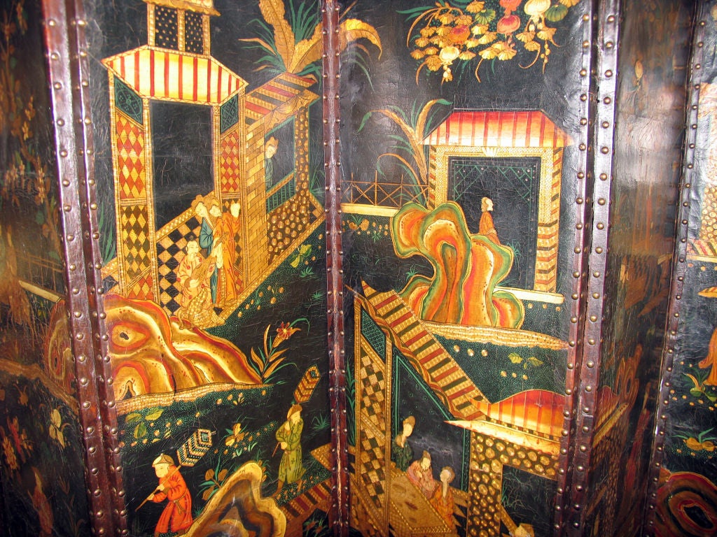 Circa 1750. Each end decorated with rectangular reserves containing flowering urns, the central Chinoiserie-decorated panels depicting a sumptuous palace with scholars, actors, musicians and nobles at various pursuits.