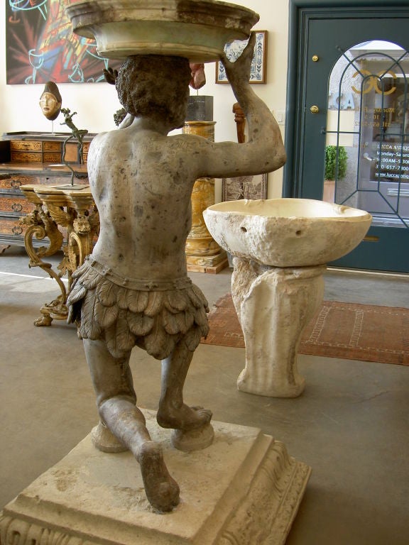A Lead Garden Sculpture of a Kneeling Blackamoor