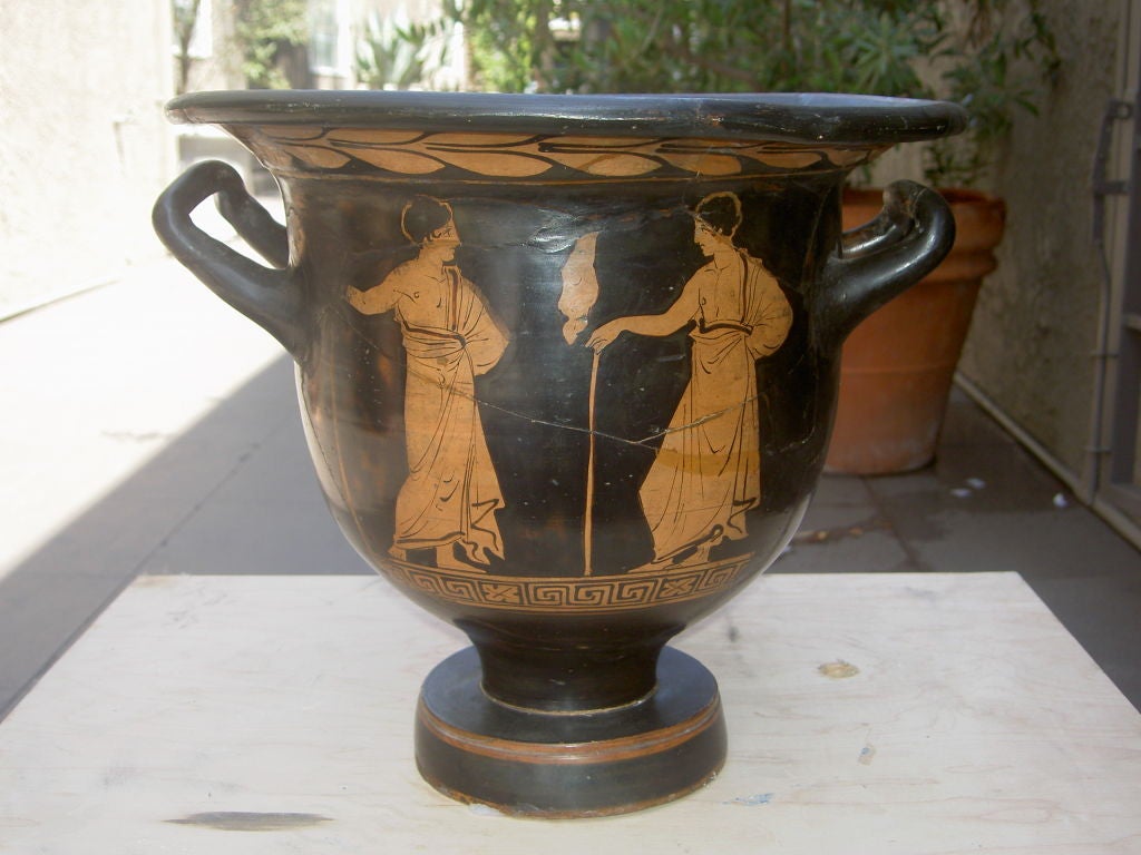 Front: Victor with targe beside herm and Nike holding fillet<br />
Back: Two draped youths<br />
Literature: Apulian Red-Figured Vases of the Plain Style, A.D. Trendall & A. Cambitoglou, Clarendon Press, Oxford, 1961, page 34, no. 17<br />
Refer: