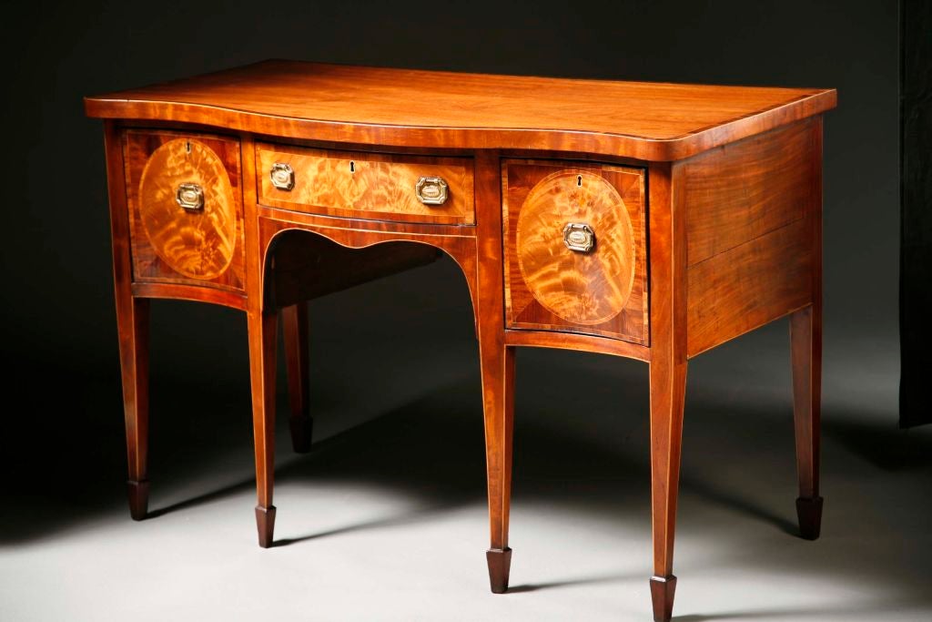 A George III Serpentine Sideboard