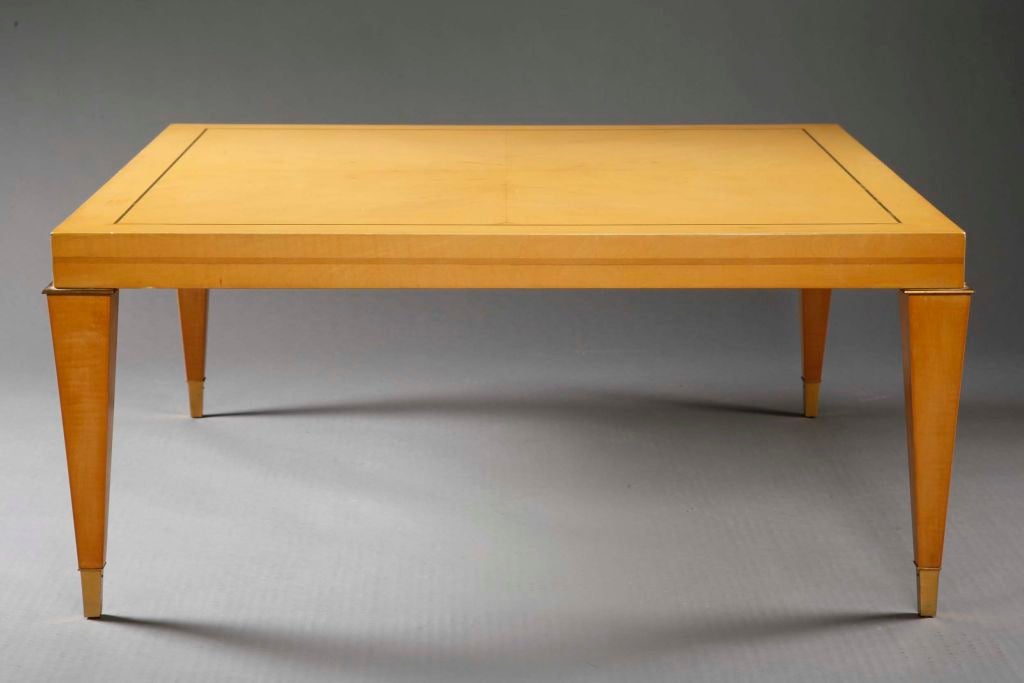 A square tapered  leg inlaid coffee table or occasional table by Albano. The top is inlaid with green stringing and raised on square tapered legs with brass square collars and ending in brass feet. Italian, circa 1960's.