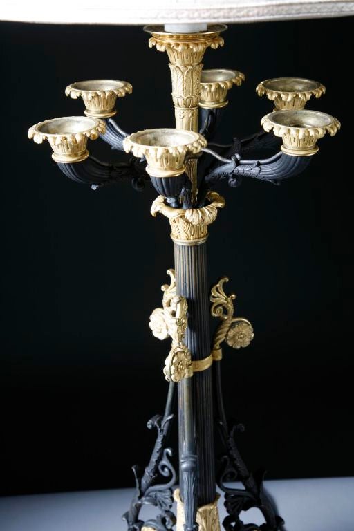An important pair of bronze Empire candleabrum signed Galle. The gilt bronze and patinated bronze elements of these monumentally proportioned lighting devices add to the success of the design by this master 