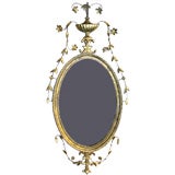 A Giltwood Oval Hepplewhite Mirror
