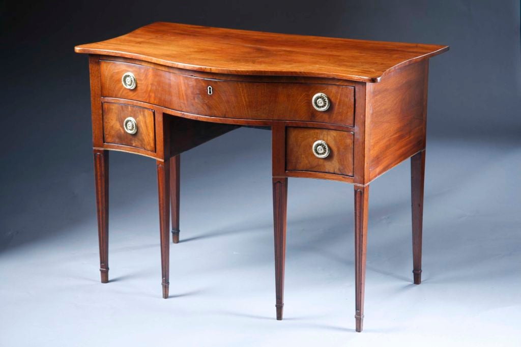 A Small Scale English Mahogany Serpentine Sideboard Server