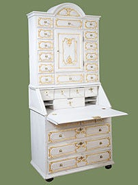 Fine Danish painted and parcel-gilt Baroque secretary. The upper
section with an arched top and a central door surrounded by small
drawers. The base with a slant front and graduated drawers all
supported with ball feet.