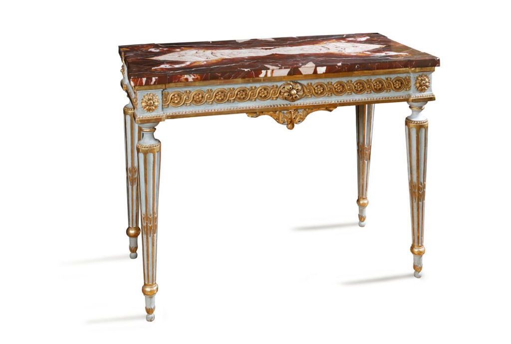Piedmontese gilded and painted console table with a guilloche, rosette, and beaded edge carved frieze, raised on circular 

fluted legs with a veneered Sicilian jasper marble top.