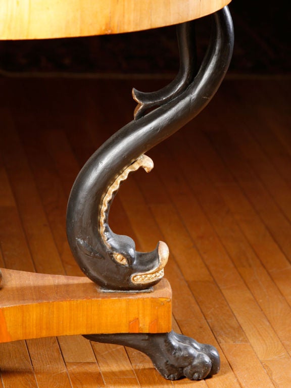 Biedermeier fruitwood dolphin base center table
