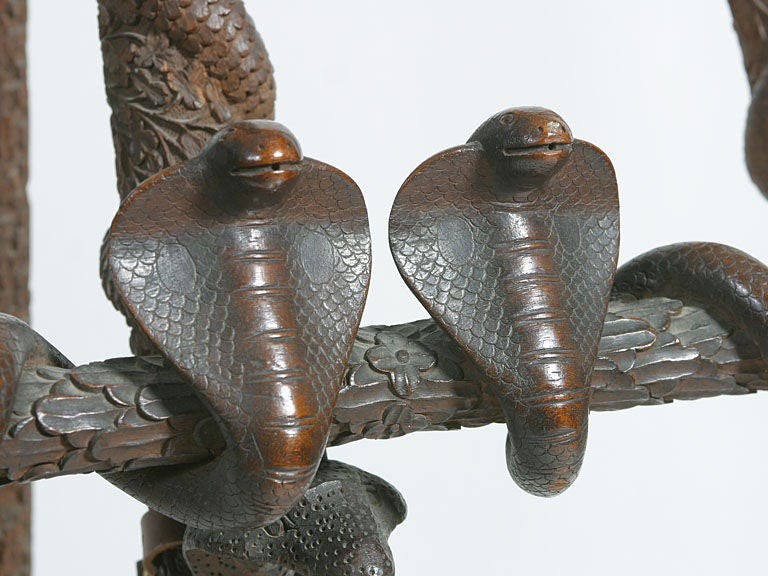 Unusual profusely carved easel with cobra and alligator motifs
perfect accent for display in an Aesthetic period setting