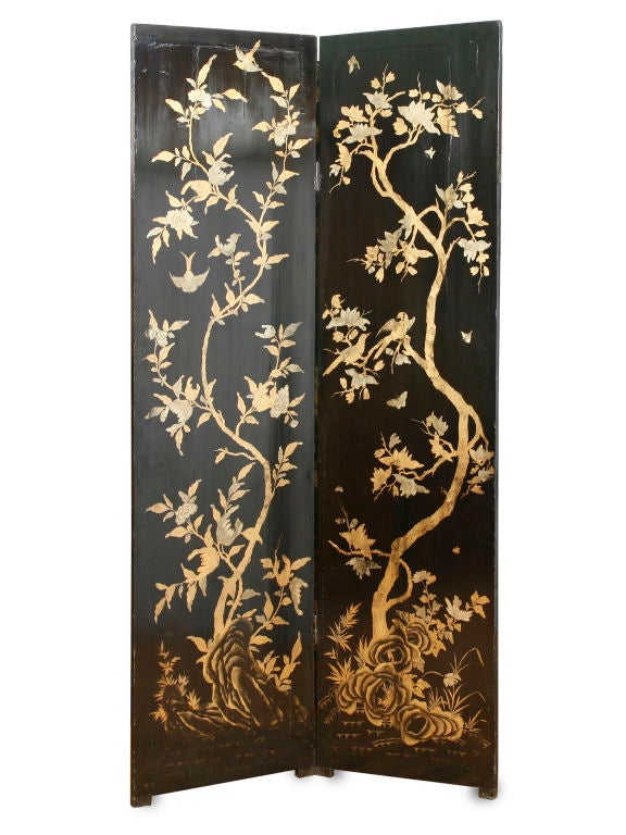 Chinese Black and Gold lacquer 8 panel screen with bold scrolling<br />
Dragon borders the main central decoration with oriental landscapes and figures. The back of the screen decorated with<br />
birds and trees. Provenance Aspry's London