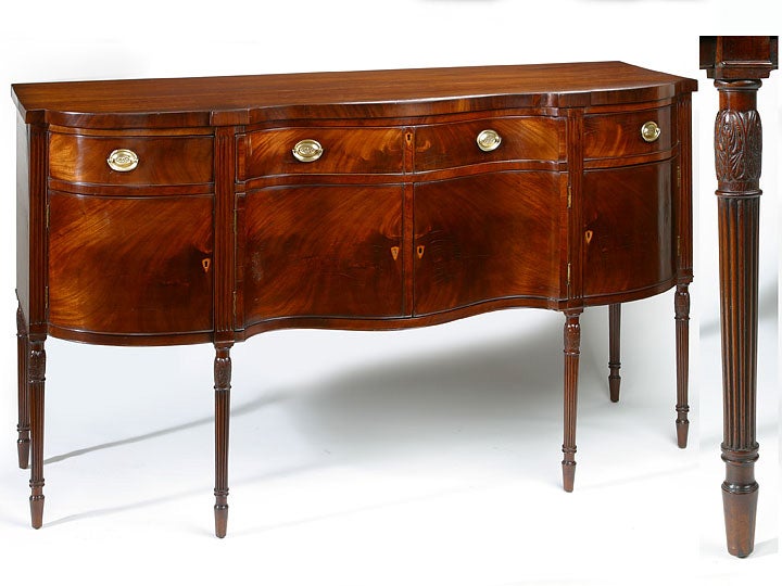 Philadelphia mahogany Federal serpentine sideboard with three<br />
drawers over two cupboard doors, the legs carved and reeded in<br />
the manner of Henry Connelly. A similar labeled example illustrated in Nancy McCelland's book 